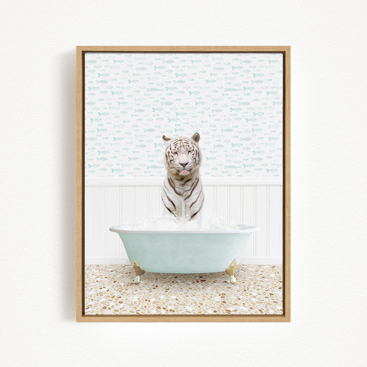 A white tiger is sitting in a light blue bathtub filled with water, surrounded by a patterned wall and a tiled floor.