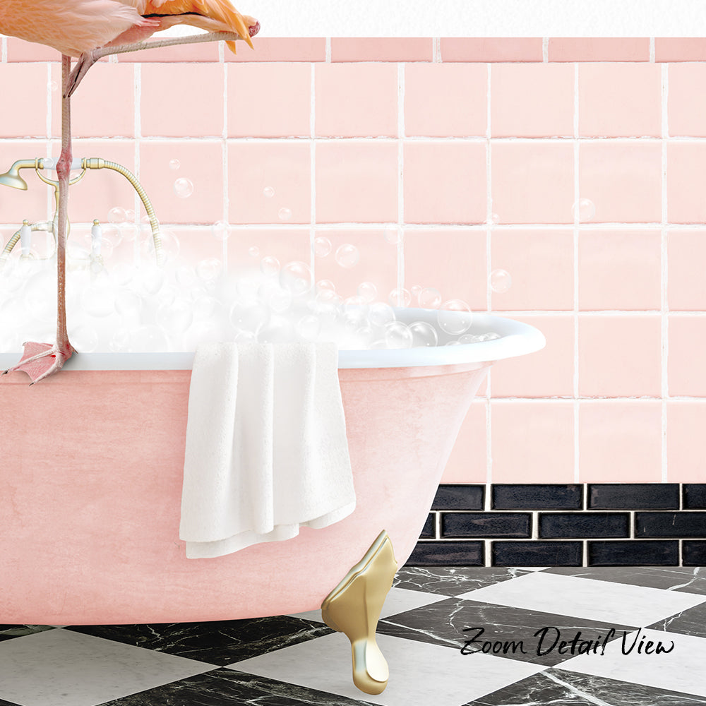 A pink claw-foot bathtub filled with bubbles, with a white towel hanging on the side and a pink flamingo standing on the edge of the tub.