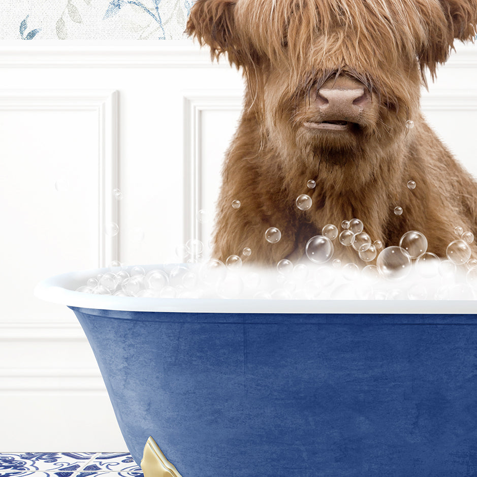 a brown dog sitting in a blue bath tub filled with bubbles