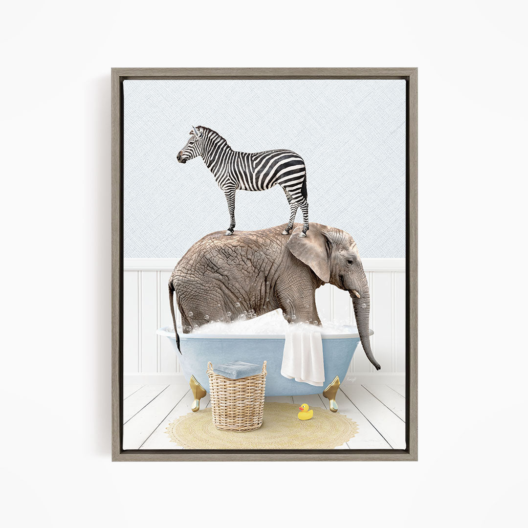A zebra standing on the back of an elephant, both in a bathtub filled with water and bubbles, with a basket of rubber ducks nearby.