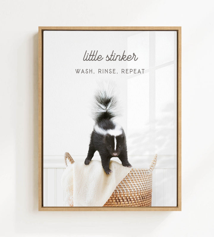A black and white skunk standing on a woven basket in a bathroom.
