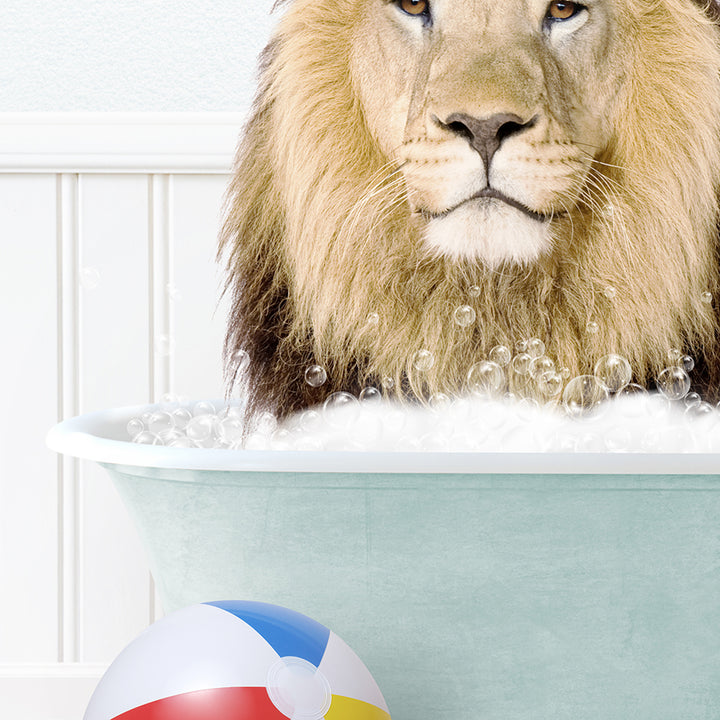 a lion in a bathtub with a beach ball