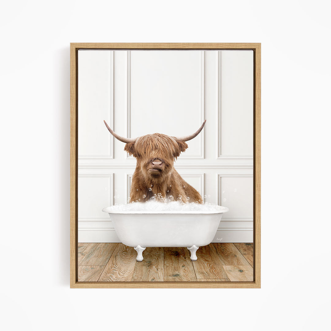 A brown cow with long horns is sitting in a white bathtub filled with water, creating a whimsical and playful scene.