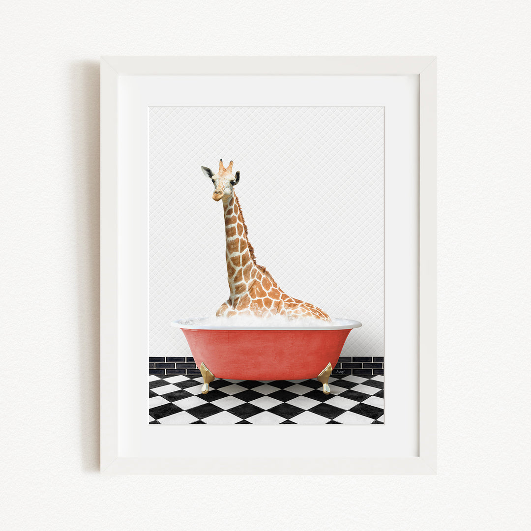 A giraffe sitting in a red bathtub on a black and white checkered floor.
