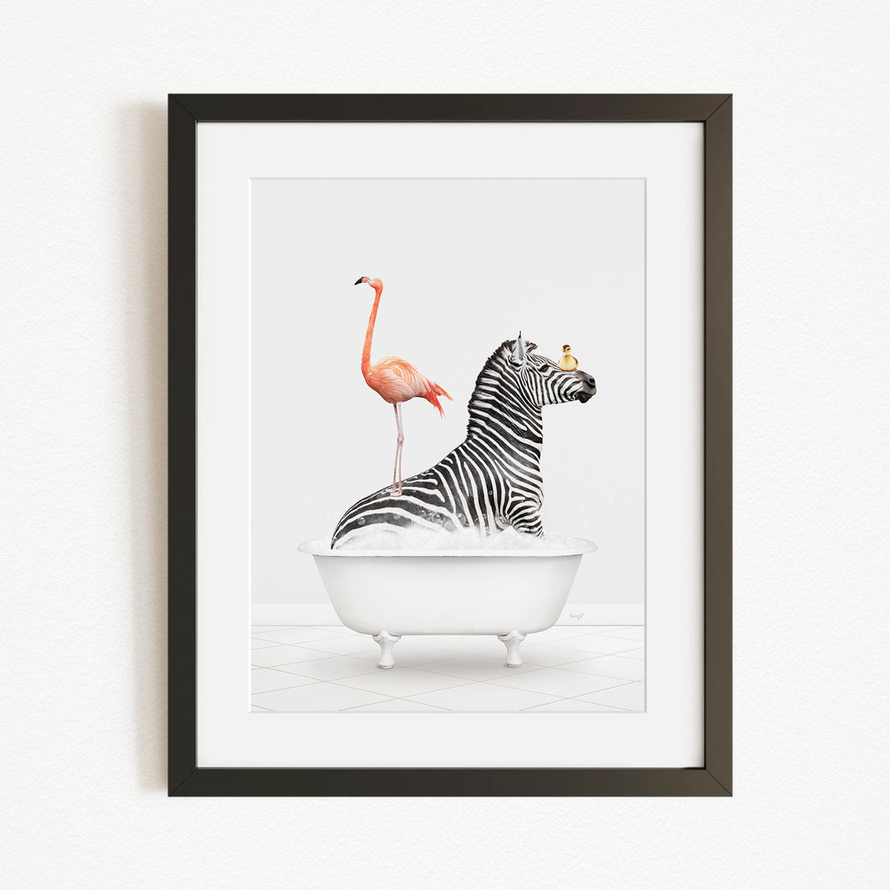A framed image depicting a zebra sitting in a bathtub, with a flamingo standing on its back.