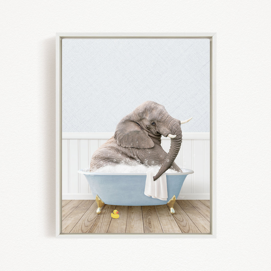 A gray elephant is sitting in a blue bathtub filled with water, surrounded by rubber ducks.