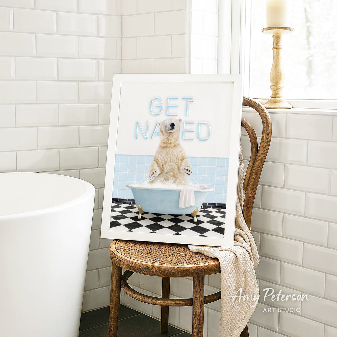 A framed image of a polar bear sitting in a bathtub, with the text "GET NAUGED" displayed on the frame.
