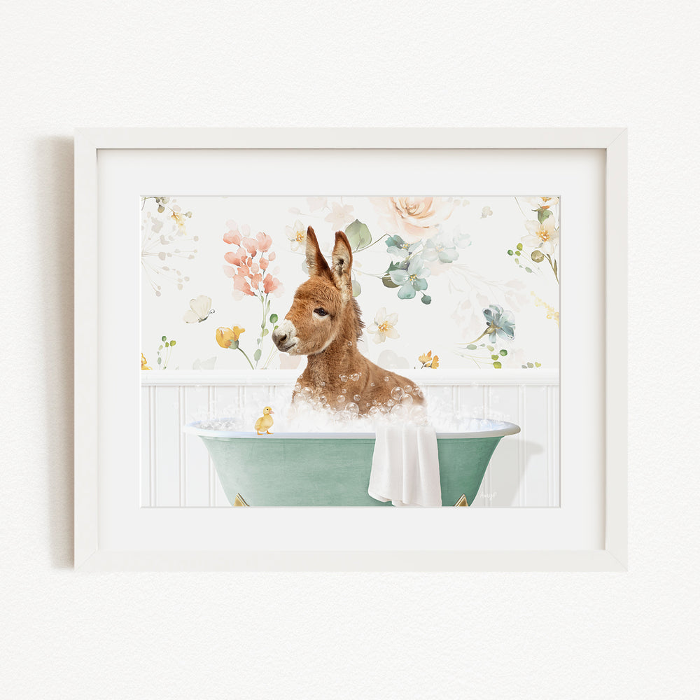 A brown kangaroo is sitting in a green bathtub filled with water, surrounded by a floral background.