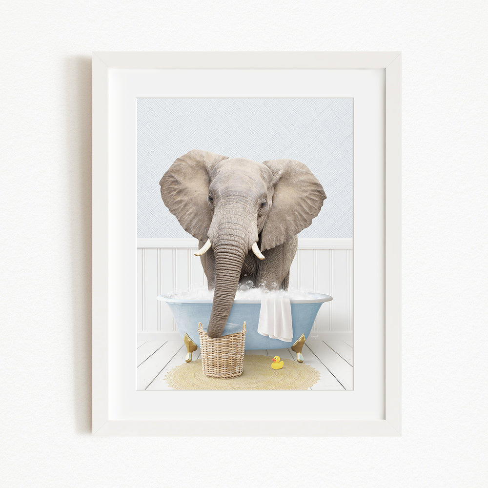 A gray elephant is sitting in a blue bathtub filled with water, surrounded by yellow rubber ducks.