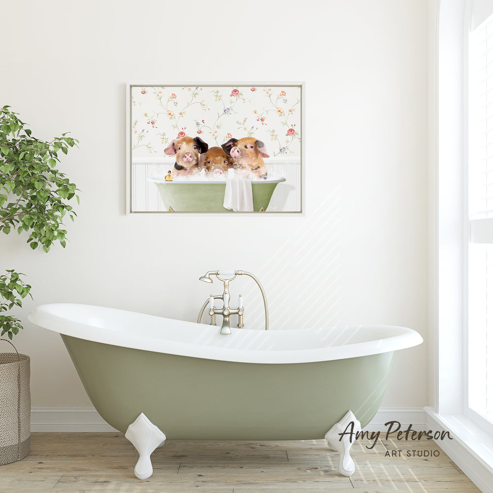 A green clawfoot bathtub filled with water, with three small brown animals, possibly hamsters, sitting in it. Above the bathtub is a framed picture of the same three animals. The bathtub is placed in a bathroom with a window and a plant nearby.
