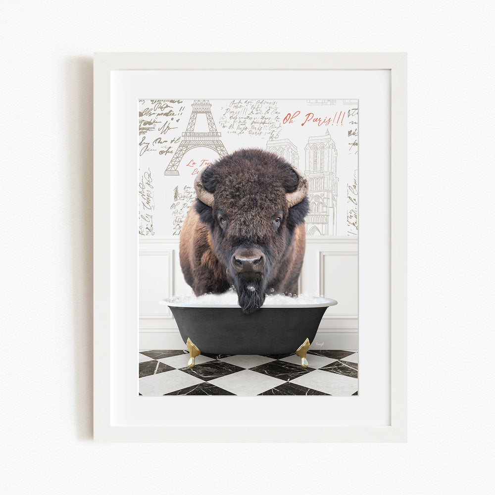 A buffalo is sitting in a bathtub, with a Paris-themed background behind it.