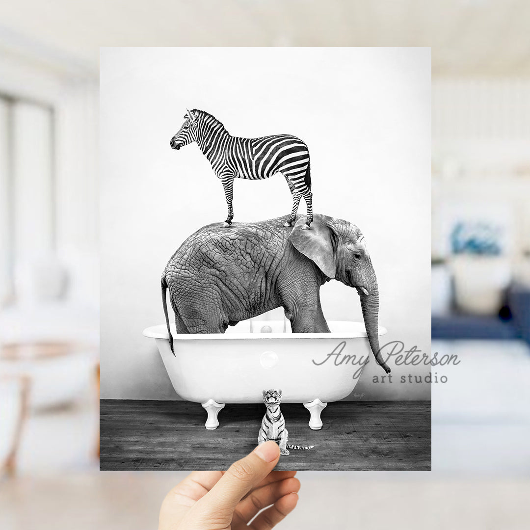 a person holding up a card with a zebra on top of an elephant in a