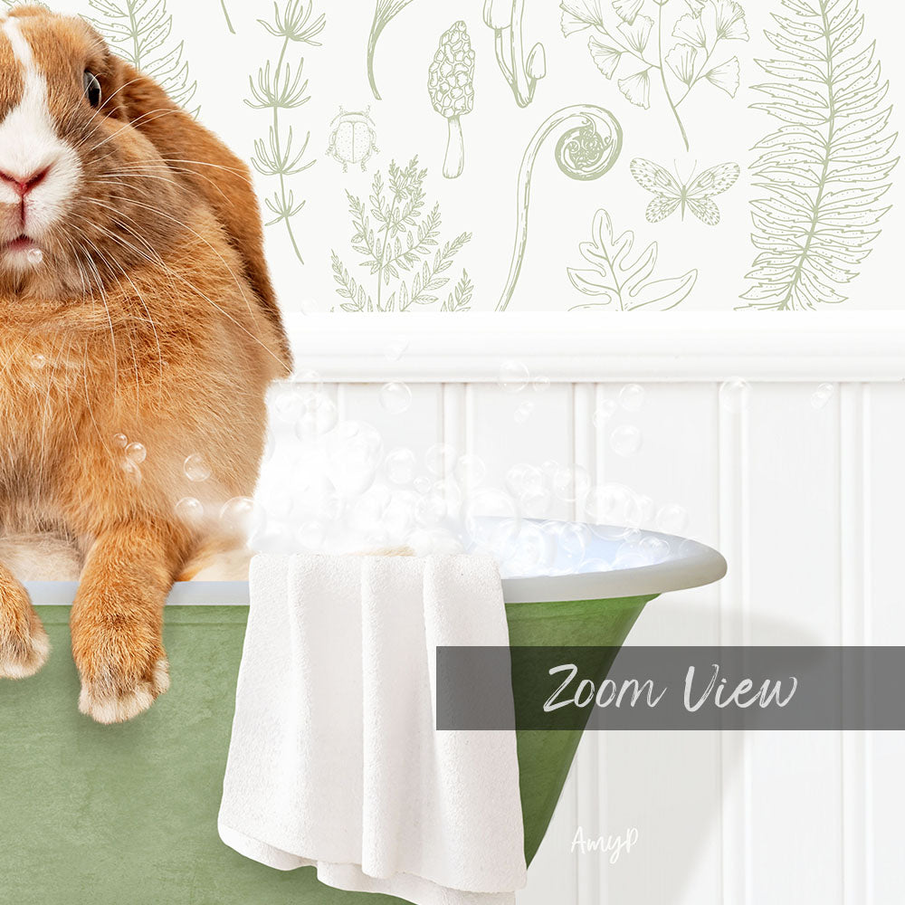 A cute orange rabbit sitting in a green bathtub filled with bubbles, with a towel and a plant decoration in the background.