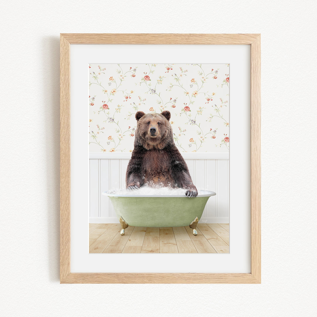 A brown bear sitting in a green bathtub, surrounded by a floral patterned wall.