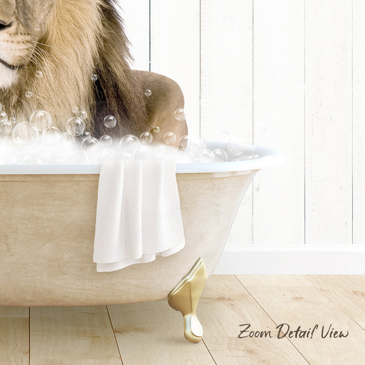 A lion relaxing in a bathtub filled with bubbles, with a towel and golden bathtub leg visible.