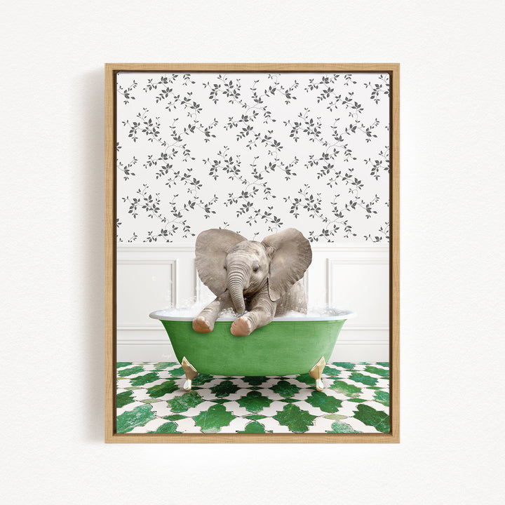 A baby elephant sitting in a green bathtub, surrounded by a patterned wall and green and white tiles.