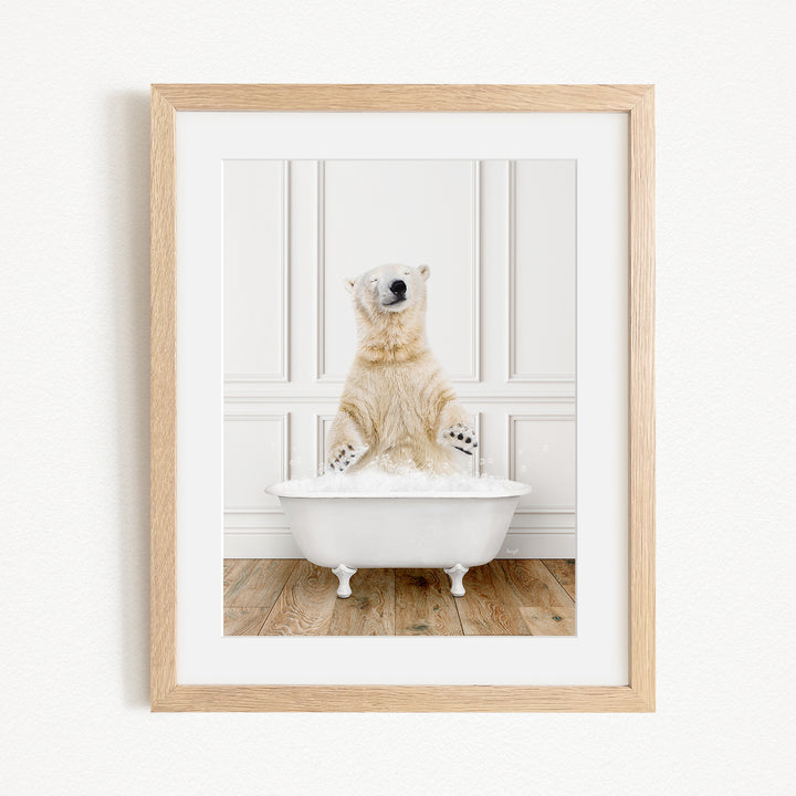 A polar bear sitting in a white bathtub, enjoying a relaxing bath.