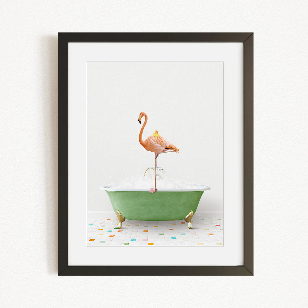 A framed image depicting a pink flamingo standing on a green bathtub filled with water, surrounded by colorful tiles on the floor.