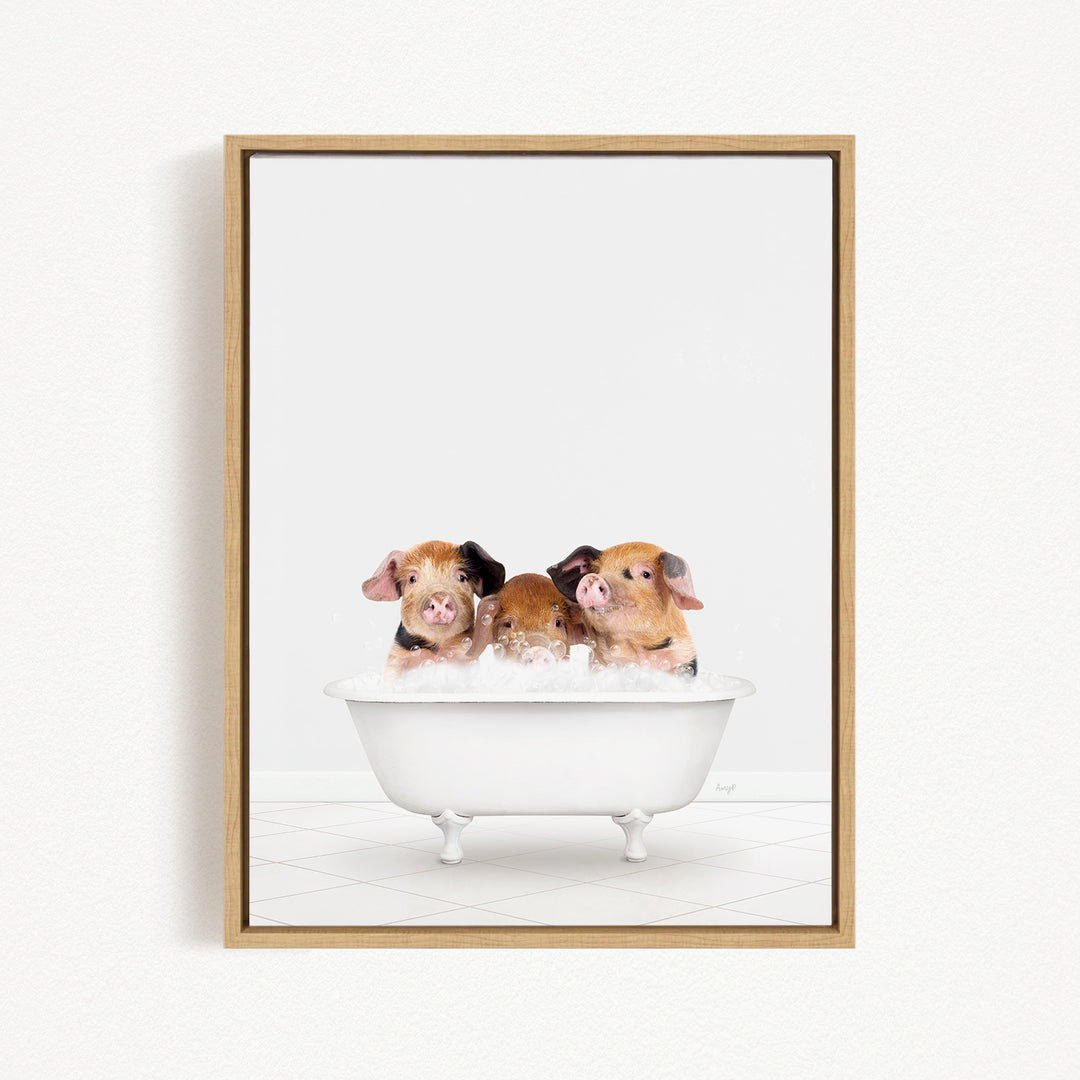 A framed image depicting three adorable pigs sitting in a white bathtub, enjoying a relaxing bath together.