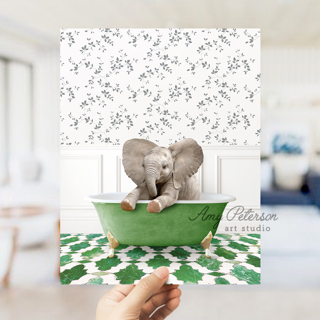 a person holding up a card with an elephant in a bathtub