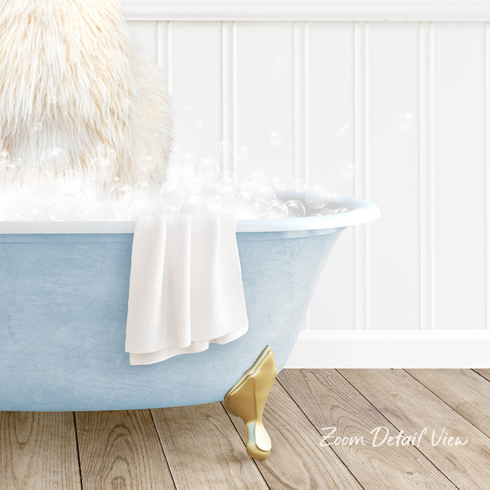 A fluffy white cat is sitting in a blue bathtub filled with bubbles, with a white towel and gold bathtub leg visible.