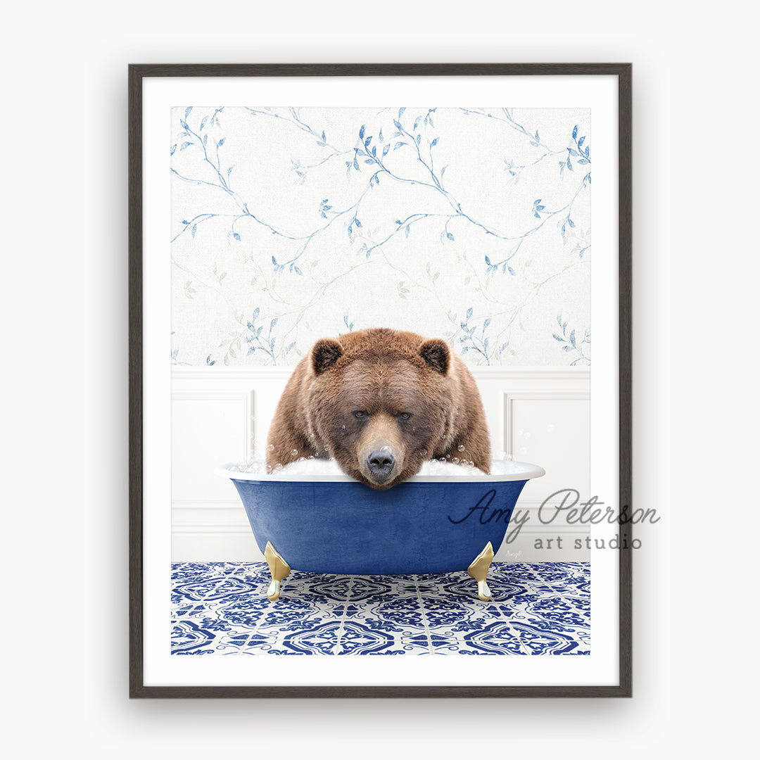 a brown bear sitting in a blue bath tub