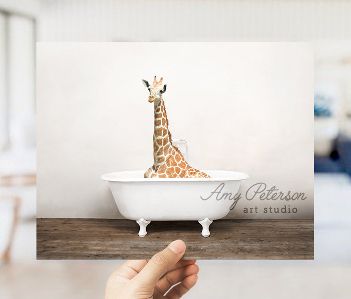 a giraffe is sitting in a bath tub