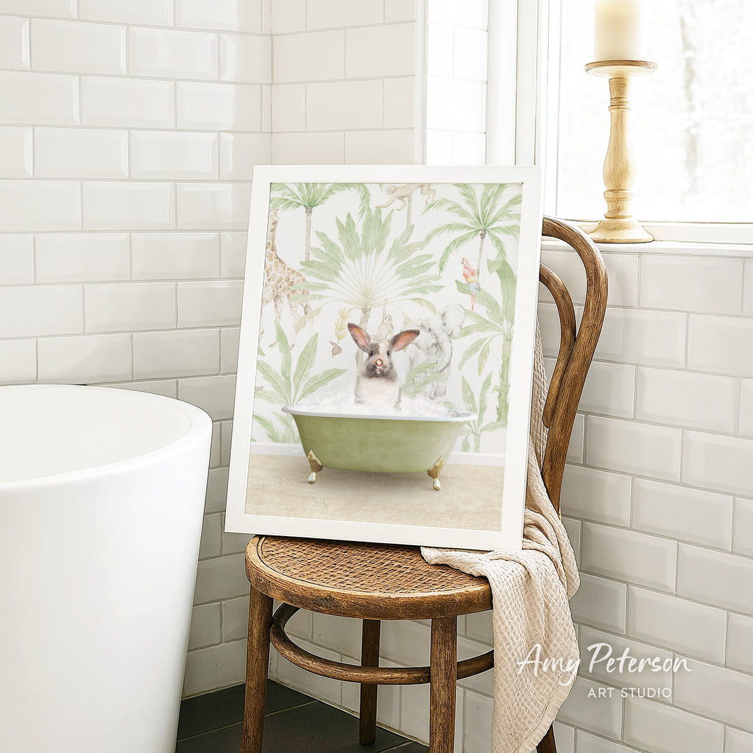 A framed print of a pig sitting in a bathtub is displayed on a wooden chair in a bathroom setting.