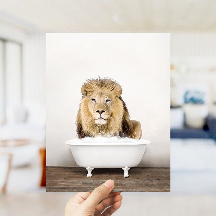 A lion sitting in a white bathtub filled with bubbles, with a blurred background suggesting a living room setting.