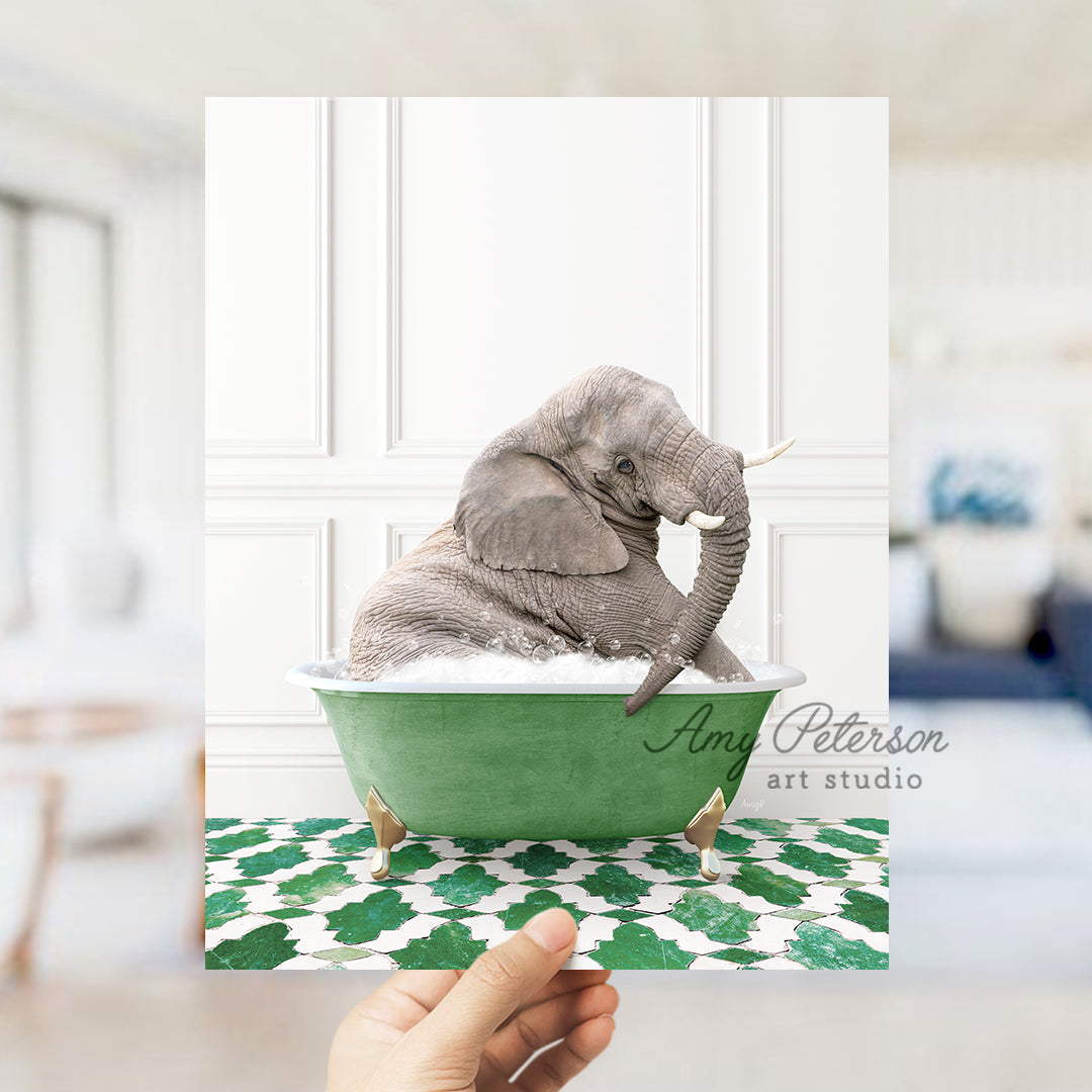 an elephant sitting in a green bath tub