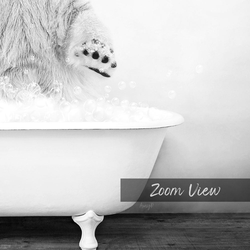 A polar bear's paw is submerged in a bathtub filled with bubbles, creating a playful and whimsical scene.