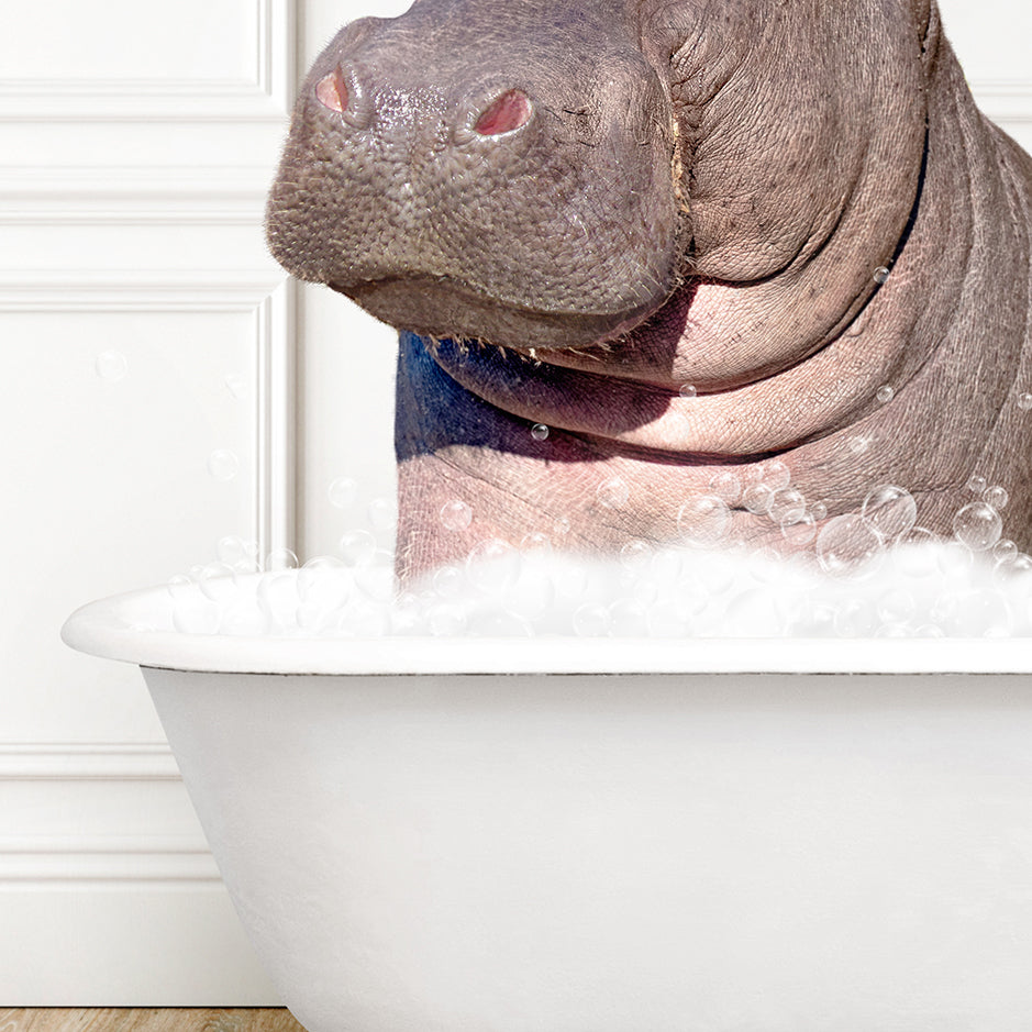 a hippopotamus sitting in a bathtub with bubbles