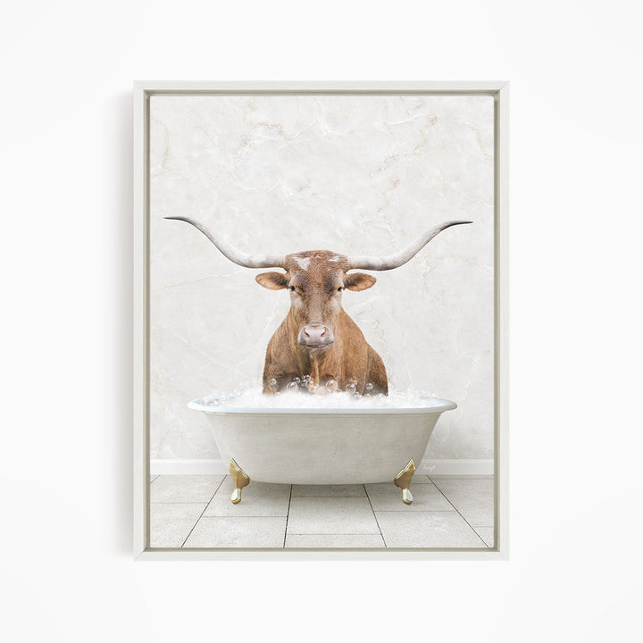 A brown cow with large horns is sitting in a white bathtub filled with water, creating a whimsical and humorous scene.
