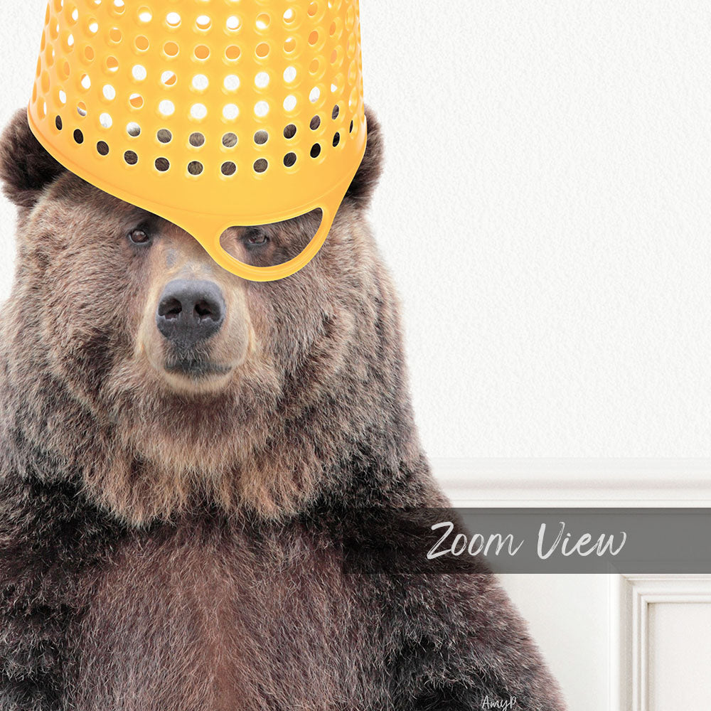 A close-up of a brown bear wearing a yellow plastic bucket hat, with the text "Zoom View" below the image.