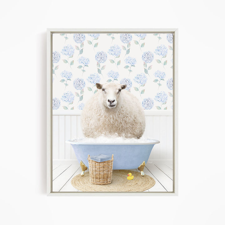 A fluffy white sheep sits in a blue bathtub filled with bubbles, surrounded by a wicker basket and yellow rubber ducks.