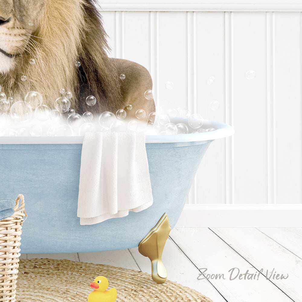 A lion is sitting in a blue bathtub filled with bubbles, surrounded by a yellow rubber duck and a white towel.