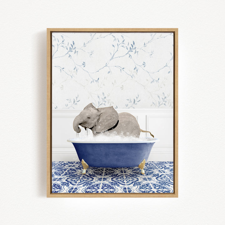 A gray elephant is sitting in a blue bathtub filled with water, surrounded by a blue and white patterned tile floor.