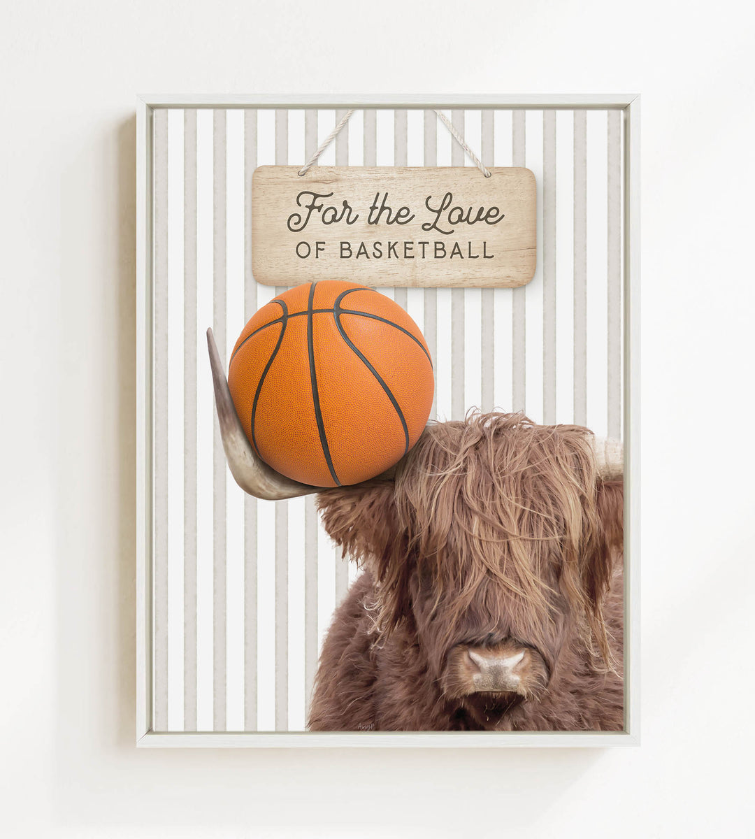 A framed image featuring a Highland cow holding a basketball, with a wooden sign above that reads "For the Love of Basketball".