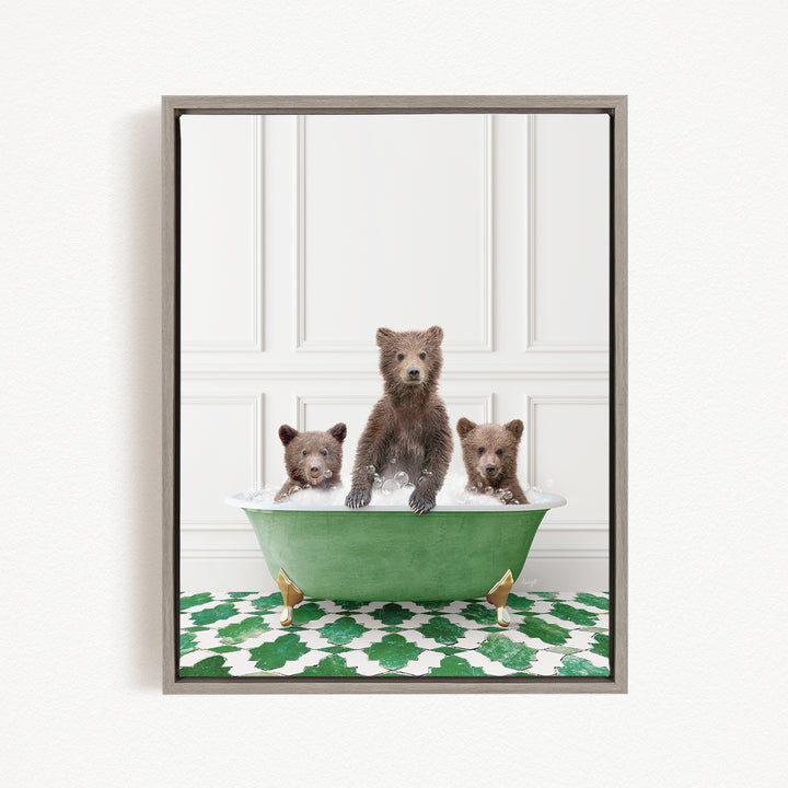 A framed image depicting three brown bears sitting in a green bathtub, with one bear sitting in the center and the other two bears sitting on either side.