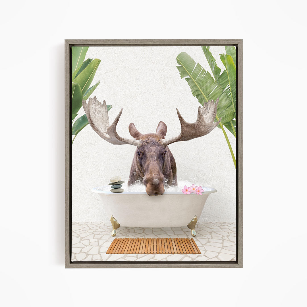 A moose is sitting in a bathtub filled with water, surrounded by tropical plants and flowers.