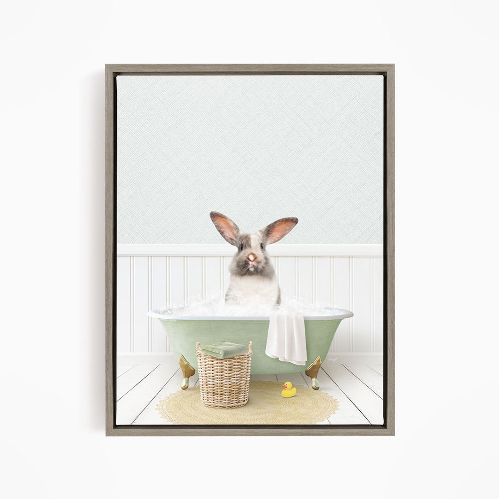 A white rabbit sitting in a green bathtub filled with bubbles, surrounded by a yellow rubber duck and a woven basket.