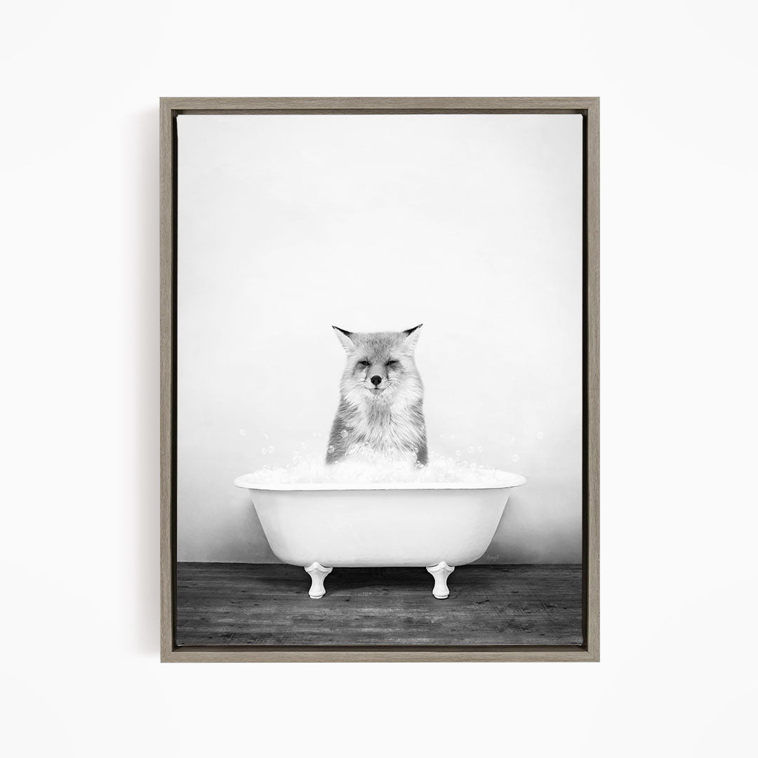 A cat sitting in a white bathtub filled with water, looking directly at the camera.