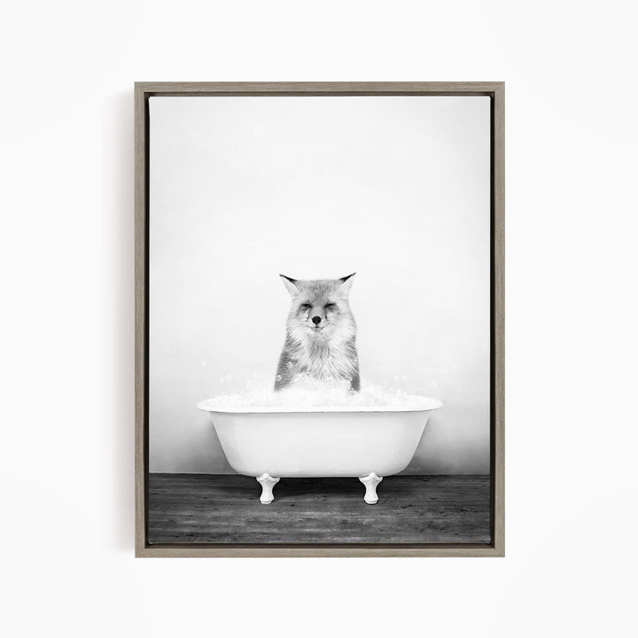 A cat sitting in a white bathtub filled with water, looking directly at the camera.