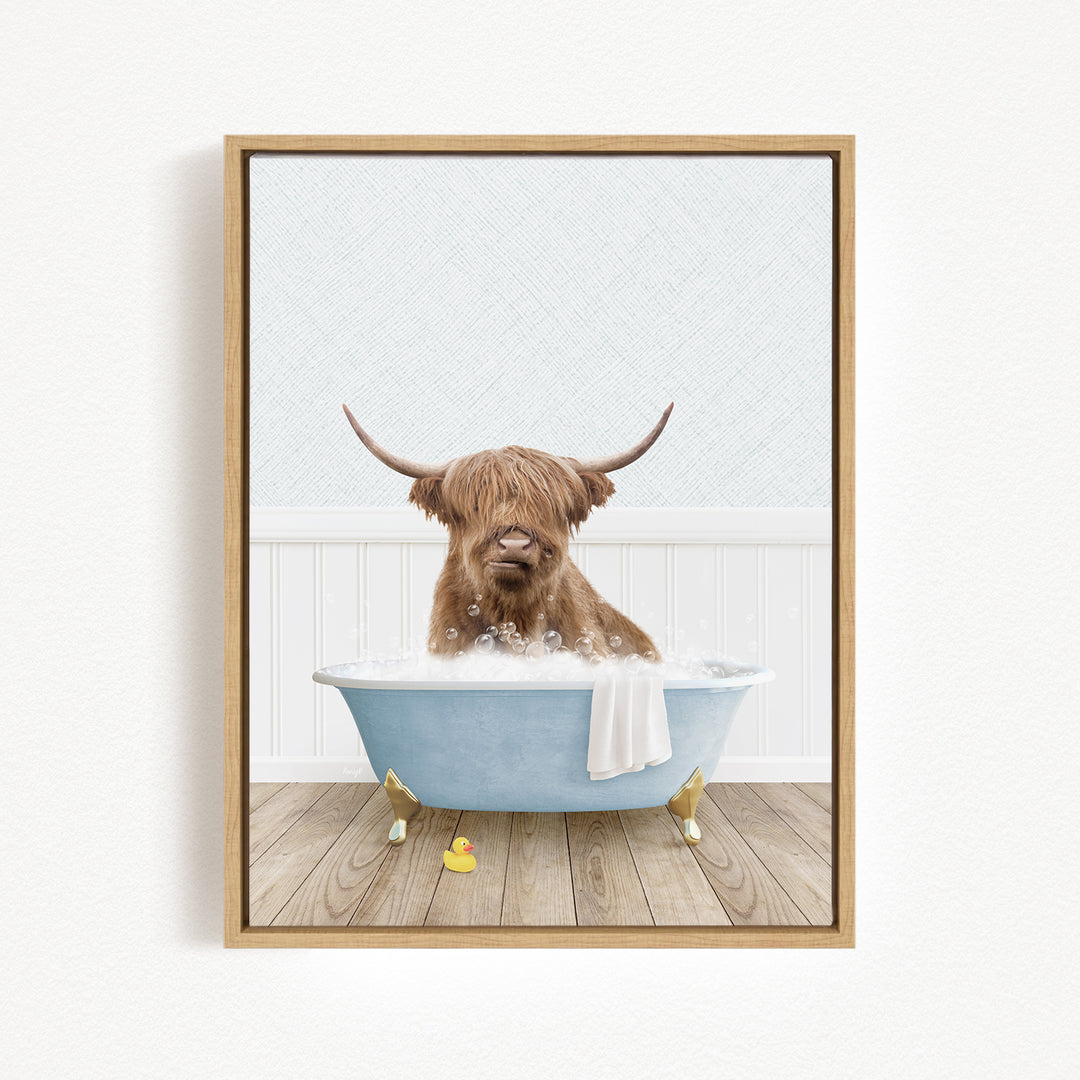 A brown cow with long horns is sitting in a blue bathtub filled with water, surrounded by a white wall and wooden floor.