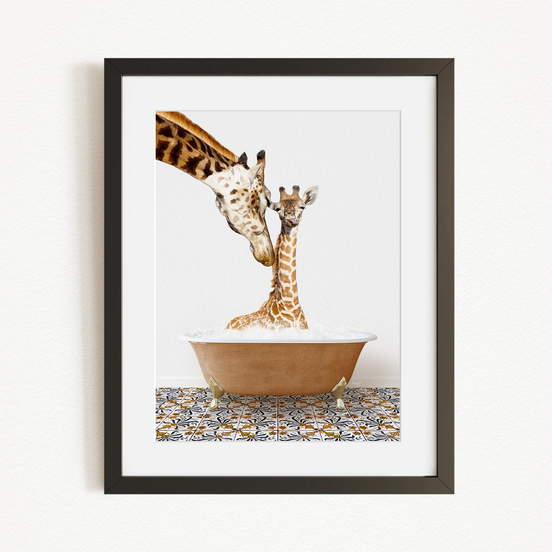 A mother giraffe and her baby giraffe are sitting together in a bathtub, with the mother gently licking her baby.