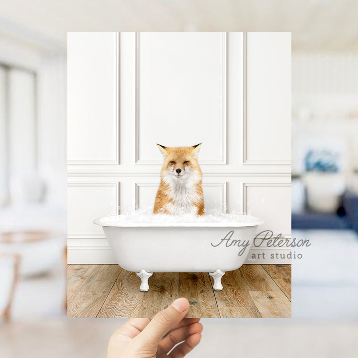 a hand holding a photo of a dog in a bathtub