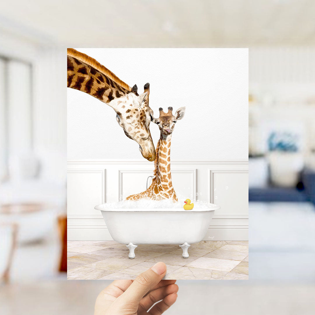 A mother giraffe and her baby giraffe are sitting together in a white bathtub, with a yellow rubber duck floating in the water.