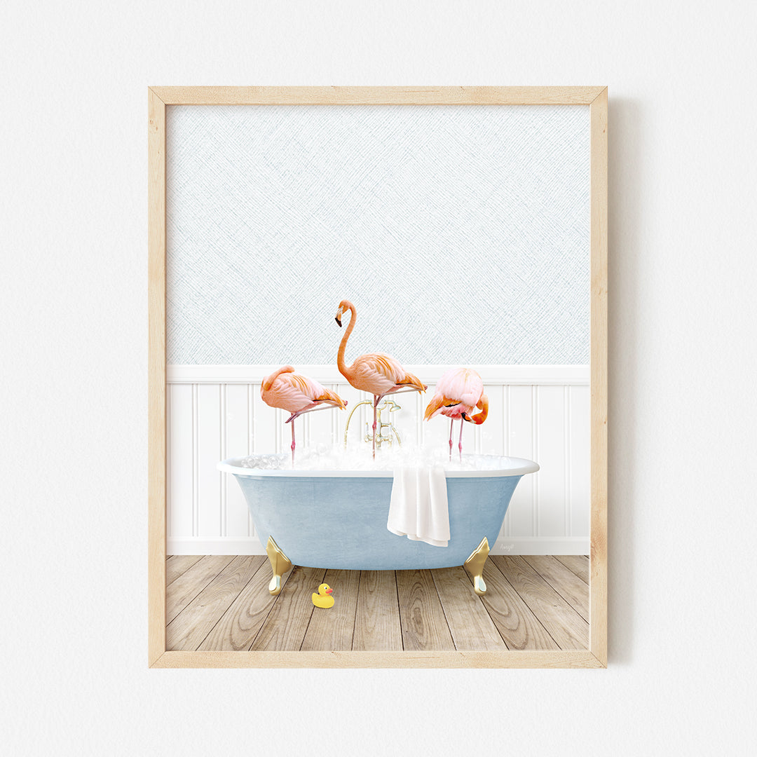 a picture of three flamingos in a bathtub