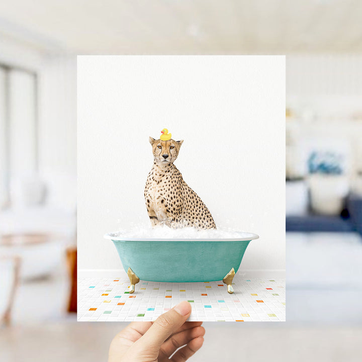 A cheetah sitting in a bathtub filled with bubbles, wearing a yellow rubber duck hat.
