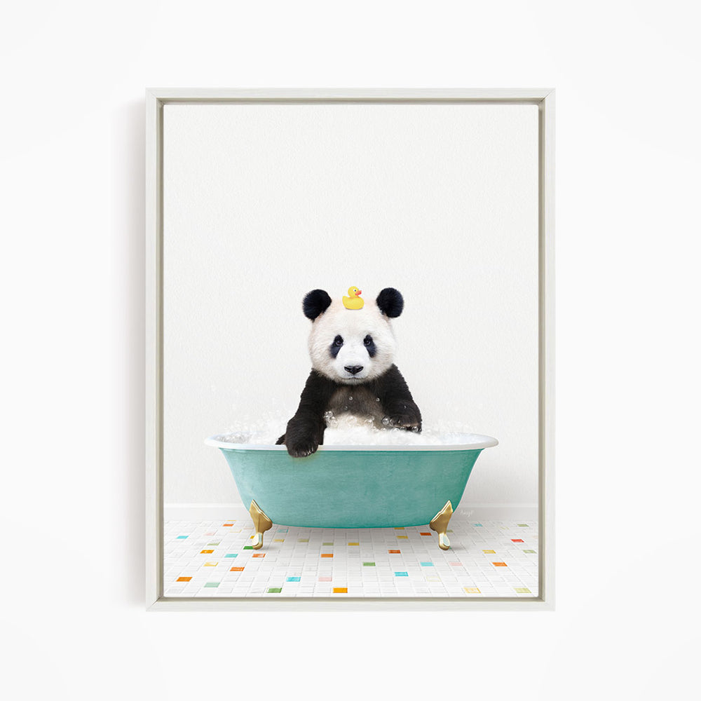 A panda bear sitting in a green bathtub, with a yellow rubber duck on its head.